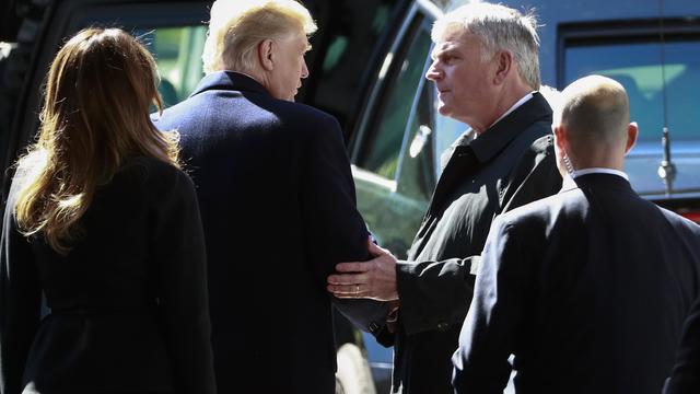 U.S. President Donald Trump speaks with Franklin Graham during the funeral service for U.S. evangelist Billy Graham in Charlotte 