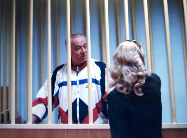 Sergei Skripal speaks to his lawyer from behind bars in this picture of a monitor outside a courtroom in Moscow, Russia, Aug. 9, 2006. 