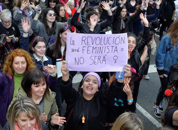 A protester holds a poster reading "The Revolution will be feminist or it won't happen" in a demonstration for women's rights on International Women's Day, in Bilbao 