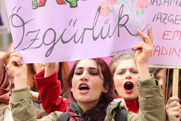 Demonstrators hold banners and shout slogans during a rally to mark International Women's Day in Ankara 