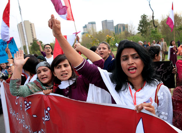 Demonstrators hold banners and shout slogans during a rally to mark International Women's Day in Islamabad 