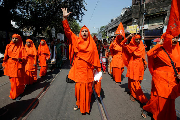 Hindu nuns shout slogans during a rally to mark the International Women's Day in Kolkata 