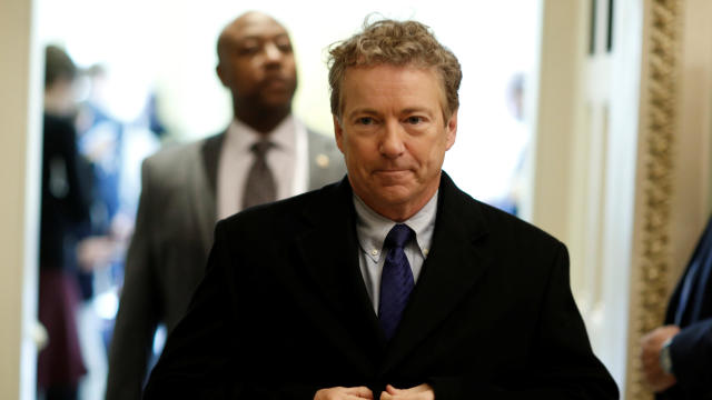 Senator Rand Paul (R-KY) walks from Senate Republican weekly policy luncheon on Capitol Hill in Washington 