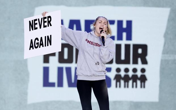 Singer Cyrus performs during the "March for Our Lives" rally demanding gun control in Washington 