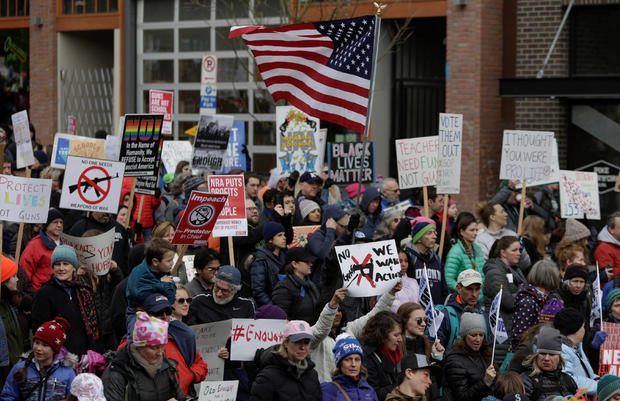 People demonstrate during a "March For Our Lives" demonstration demanding gun control in Seattle 