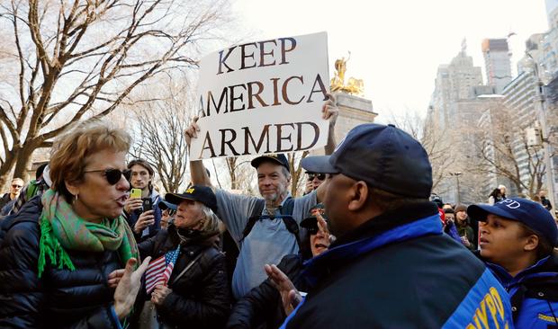 A man holds an anti-gun control sign during a "March For Our Lives" demonstration demanding gun control in New York City 