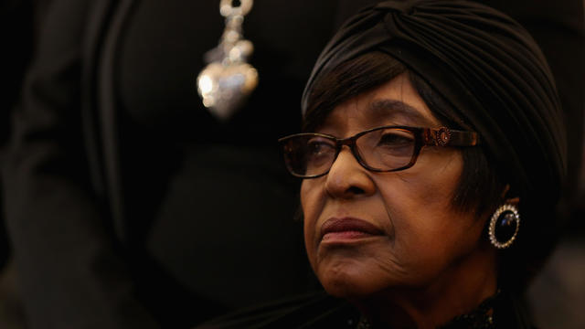 Winnie Madikizela-Mandela stands outside parliament after South African President Jacob Zuma was re-elected as president during the first sitting of the National Assembly in Cape Town, South Africa, May 21, 2014. 