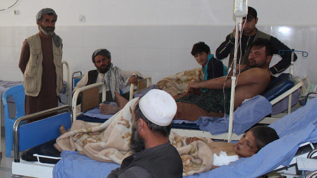 Afghans receive treatment at a hospital after MondayÕs airstrike in Kunduz province, Afghanistan 