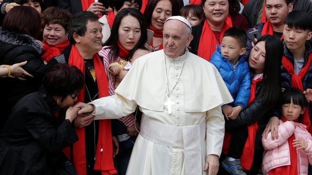 Pope Francis is greeted by Chinese pilgrims during the Wednesday general audience in Saint Peter's square at the Vatican 