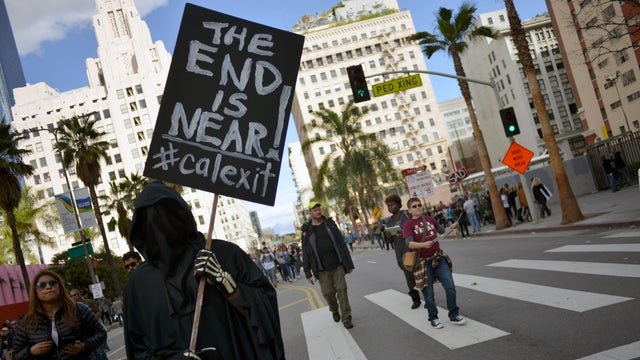 A protester holds a "Calexit" sign during the Women's March on Jan. 21, 2017, in Los Angeles, California. 