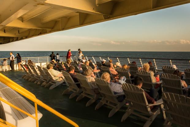passengers enjoy outdoor deck 