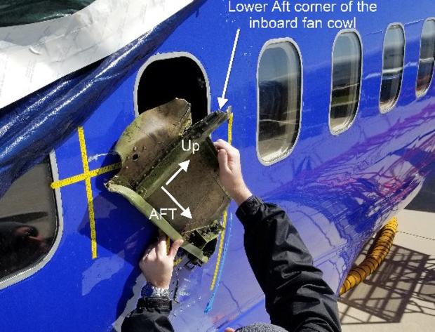 NTSB southwest Picture of window 14 with portion of engine inboard fan cowl. 