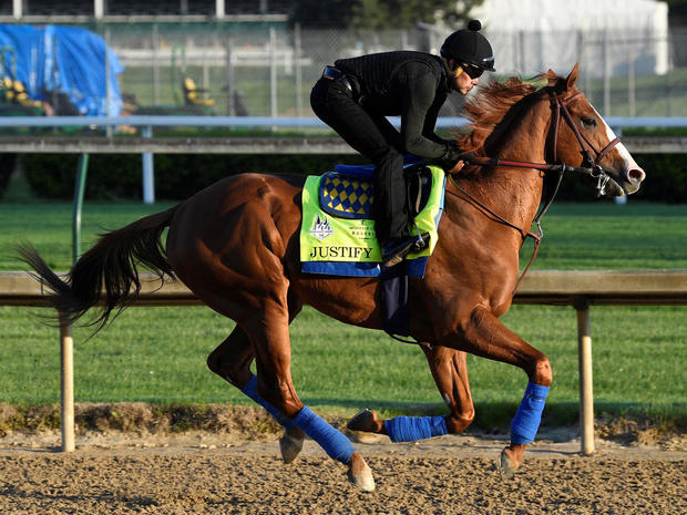 An exercise rider works out Kentucky Derby hopeful Justify at Churchill Downs in Louisville 