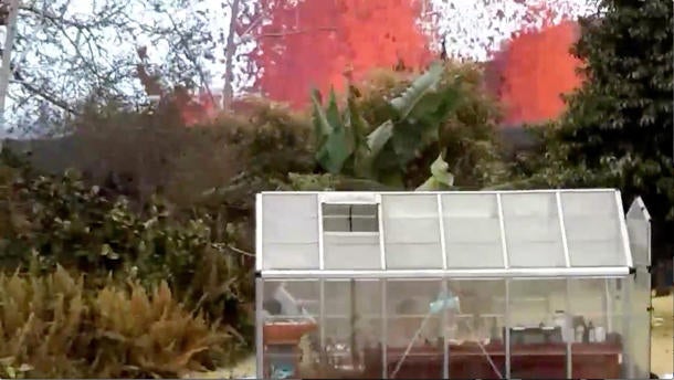 Lava is seen from a fissure appearing behind a resident's backyard in Puna, Hawaii, U.S. in this still frame taken from May 6, 2018 video obtained from social media. 