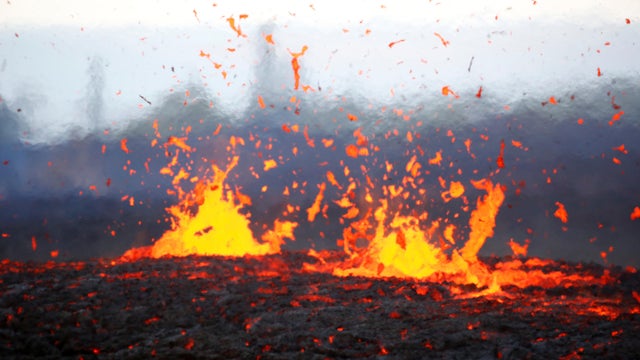 Lava erupts from a fissure on the outskirts of Pahoa during ongoing eruptions of the Kilauea volcano in Hawaii May 14, 2018. 