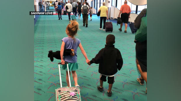 Heartwarming photo of kids who met on an airplane goes viral, and now they've been reunited 