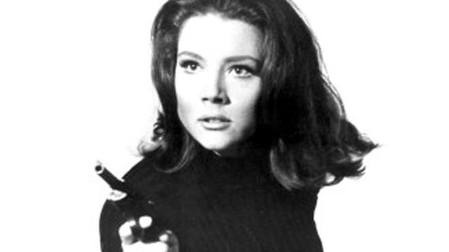 diana-rigg-avengers-gun-pose-bw-promo.jpg 