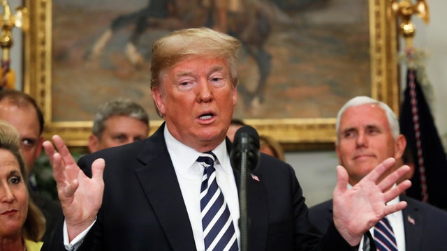 U.S. President Donald Trump gestures as he speaks before the signing ceremony for S. 2155 - Economic Growth, Regulatory Relief, and Consumer Protection Act in the Roosevelt Room at the White House in Washington 