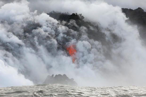 Lava flows into the Pacific Ocean southeast of Pahoa 