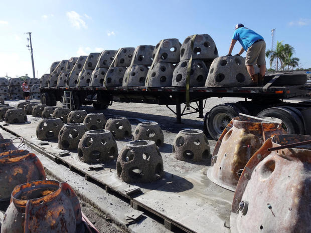 Workers unload some of the 66 Eternal Reef balls with plaques representing each of the submarines and crewmembers lost at sea since 1900, in Sarasota 