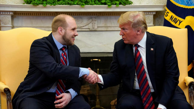 U.S. President Donald Trump shakes hands with Josh Holt, an American missionary who was released by Venezuela, in the Oval Office of the White House in Washington 