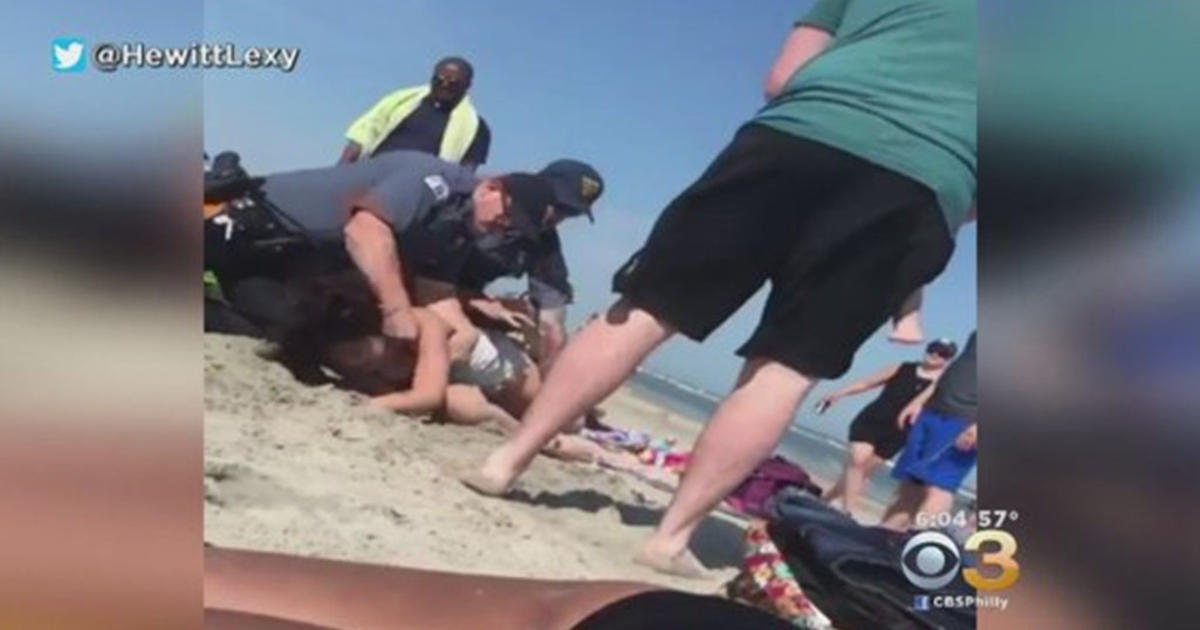 Police Investigating Video Showing Officer Punching Woman On Beach While Trying To Subdue Her 