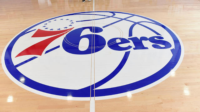 The Philadelphia 76ers logo is seen on the wooden floor at the Sixers Training Complex in Camden, New Jersey, on Sept. 9, 2017. 