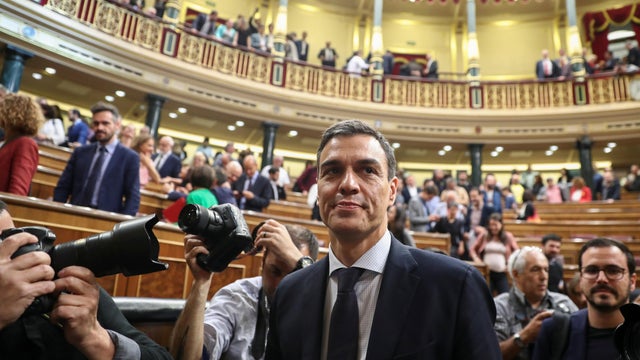 Spain's new Prime Minister and Socialist party (PSOE) leader Pedro Sanchez stands in the chamber after a motion of no confidence vote at parliament in Madrid 