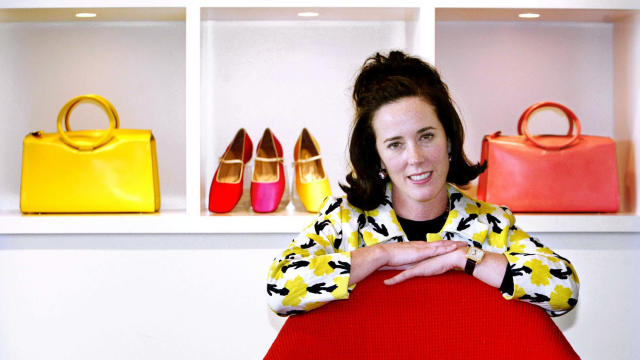 Designer Kate Spade poses with handbags and shoes from her collection in New York May 13, 2004. 