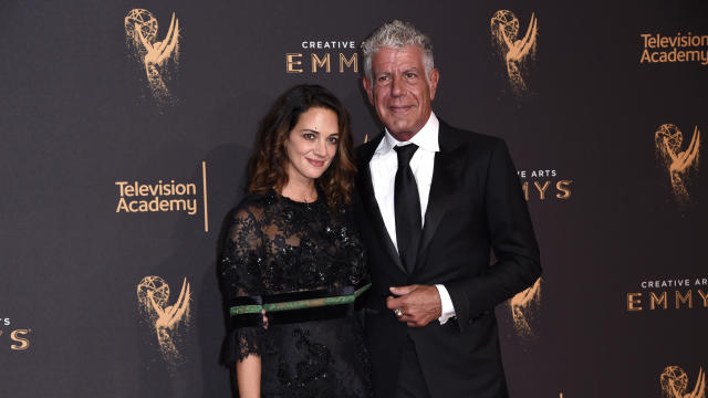Asia Argento and Anthony Bourdain arrive at the Creative Arts Emmy Awards at the Microsoft Theater on Sept. 9, 2017, in Los Angeles. 