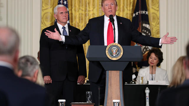 U.S. President Donald Trump signs an executive order to create the National Space Council, accompanied by former astronauts Buzz Aldrin (2nd-R), Alvin Drew (3rd-R) and Dave Wolf (L) in the Roosevelt room of the White House, in Washington, DC, U.S. 