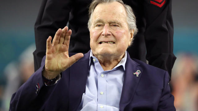 FILE PHOTO -  Former U.S. President George H.W. Bush arrives on the field ahead of the start of Super Bowl LI between the New England Patriots and the Atlanta Falcons in Houston 