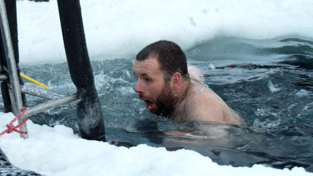 Scott Clifford swims in a pool cut into the sea ice in Antarctica on June 21, 2018, in a photo released by the Australian Antarctic Division. 