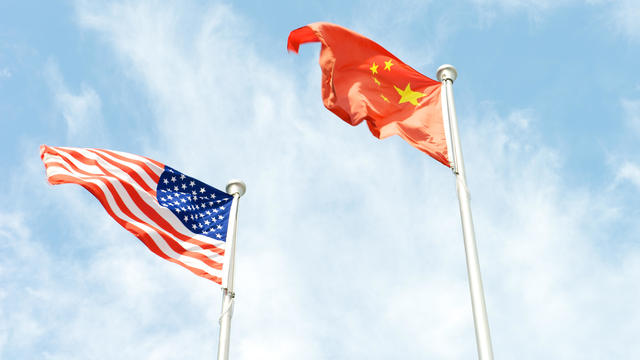 China and American flag flying together 
