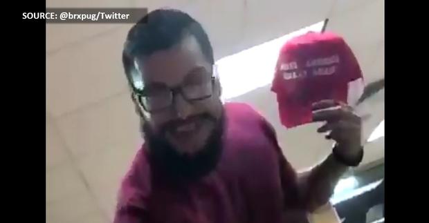 Man takes teen's MAGA hat after pouring drink on him at San Antonio Whataburger. (SOURCE: @brxpug/Twitter) 