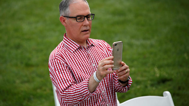 Administrator of the Environmental Protection Agency Scott Pruitt takes a picture during a picnic for military families celebrating Independence Day at the White House in Washington 