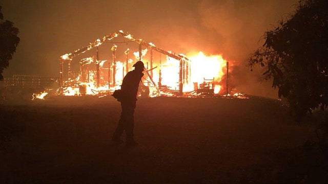 A wildfire burns a structure in Goleta 
