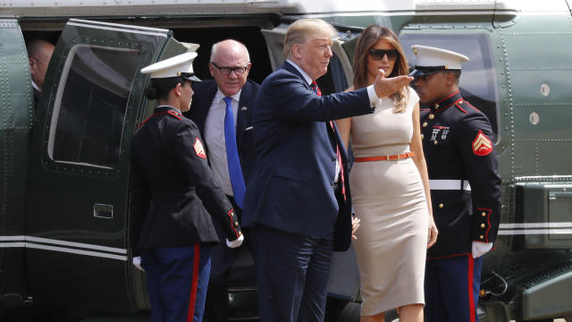 People inflate a helium filled Donald Trump blimp which they hope to deploy during The President of the United States' upcoming visit, in London 