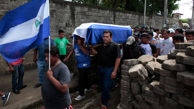 Relatives and friends carry the casket of Jose Esteban Sevilla Medina in Monimbo 