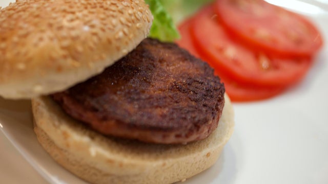 The world's first lab-grown beef burger is seen after it was cooked at a launch event in west London 