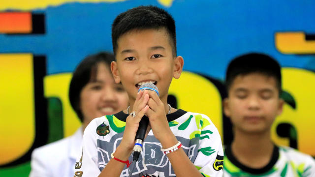 Chanin Vibul Rungruang, 11, introduces himself during the news conference in Chiang Rai 