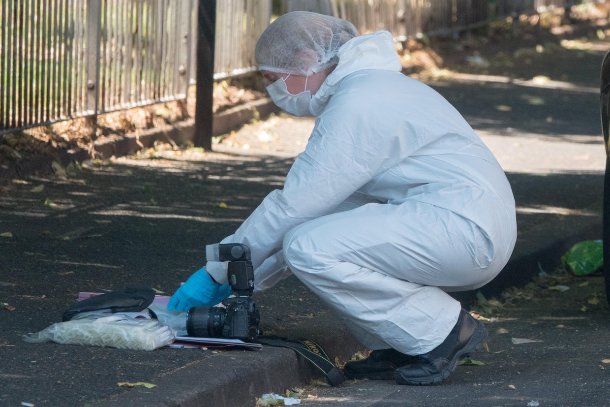 Police At The Scene Of A Burglary That Left One Dead And Two Critically Injured 
