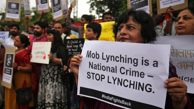 People shout anti-government slogans during a protest against recent lynchings across the country, in Ahmedabad, India, July 23, 2018. 