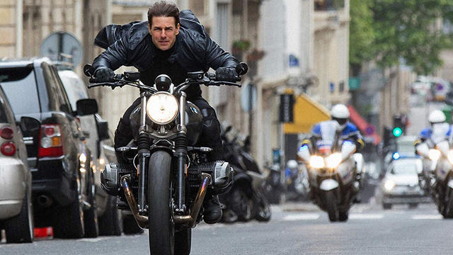 mission-impossible-fallout-tom-cruise-on-rockface-motorcycle-promo.jpg 