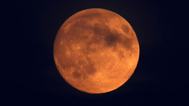 The moon is seen above London, Britain, July 26, 2018. 