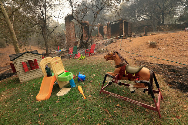 Toys stand untouched near a home destroyed by the Carr Fire west of Redding 