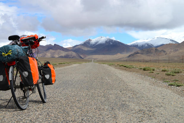 Long distance cycling on M41 Pamir Highway, Pamir Mountain Range, Tajikistan 