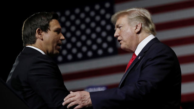 U.S. President Donald Trump talks with Republican Florida governor candidate Ron DeSantis during a Make America Great Again Rally at the Florida State Fairgrounds in Tampa, Florida, U.S. 