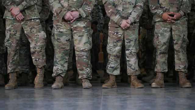 Members of the Texas National Guard wait for Governor Abbott to speak about security on the Mexico-U.S. border in Weslaco 