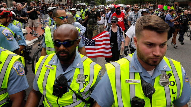 Police surround demonstrators participating at a white nationalist-led rally in Washington 